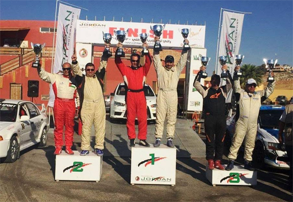 Winners hold their trophies on the podium of the National Rally Championship 4th round in Madaba on Friday (Photo courtesy of Jordan Motorsport)